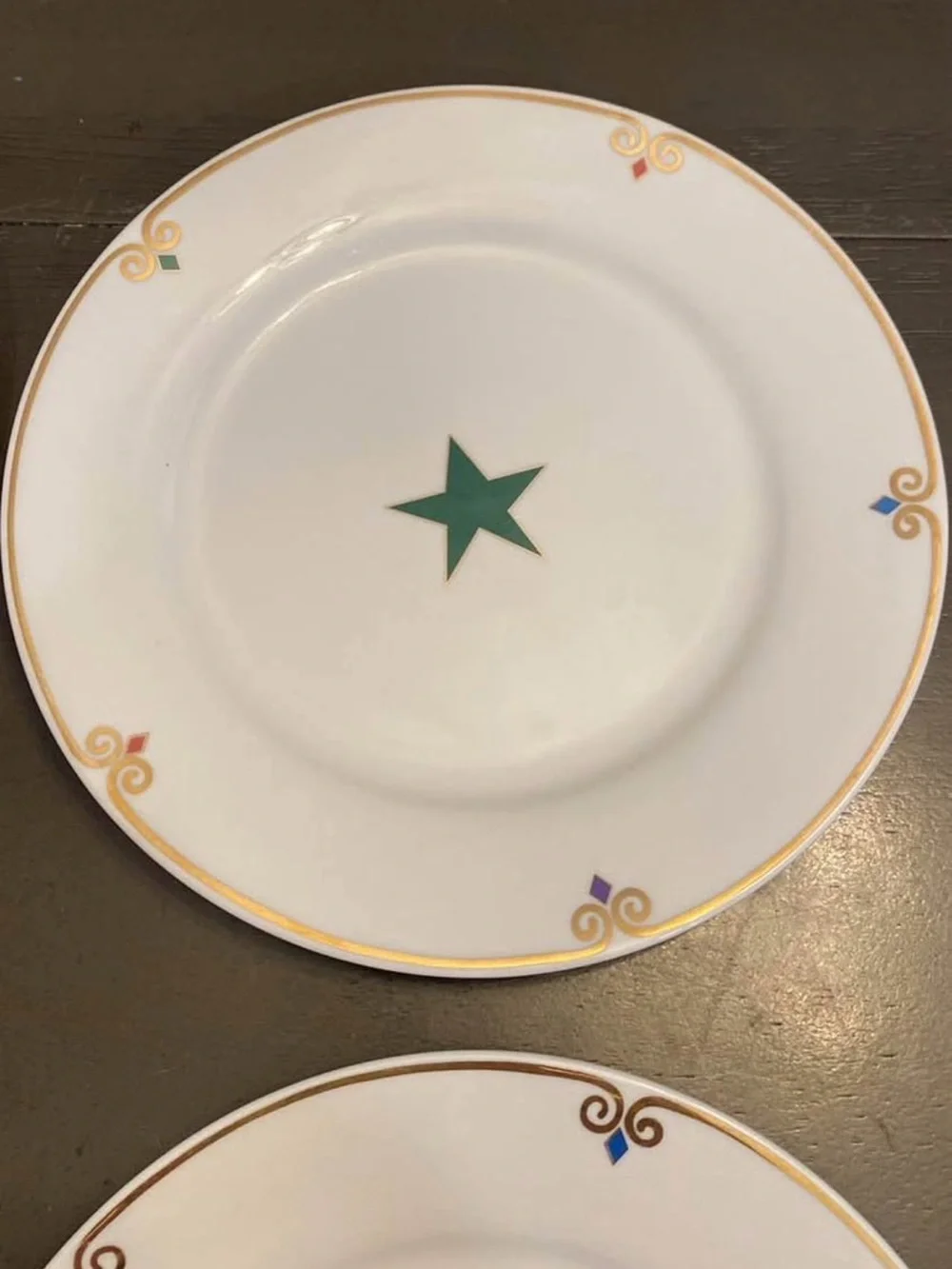 Pier 1 White  Plates with Multicolor Star Accents and Gold Trim